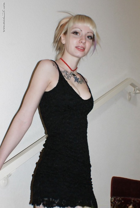 Alternative babe Symone posing for non nude pics in boots and black dress