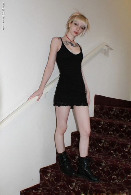 Alternative babe Symone posing for non nude pics in boots and black dress