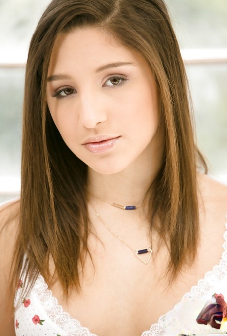 Young babe Abella Danger posing for nude photos in knee high socks