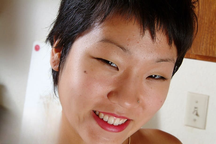 Petite Oriental first timer Vicky revealing her nice perky tits and furry pits