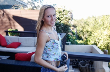 Blonde first timer Hollie Mack undressing for nude photos outdoors