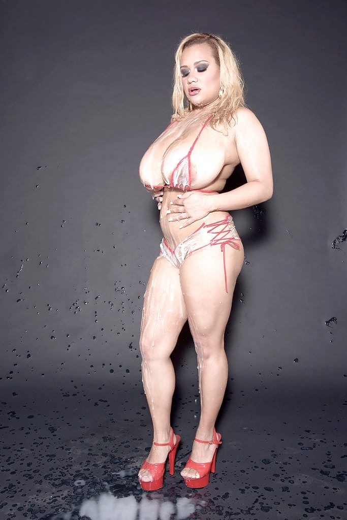 Buxom blonde MILF Liza Biggs shows off huge hooters after bukkake session