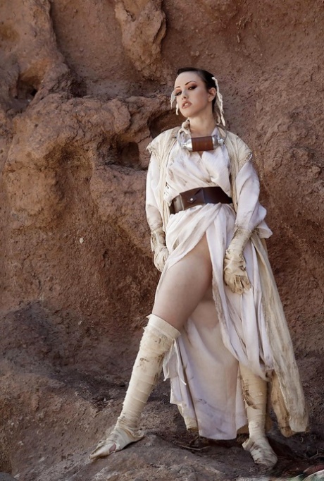 Cosplay pornstar Jennifer White spreading shaved babe pussy outdoors