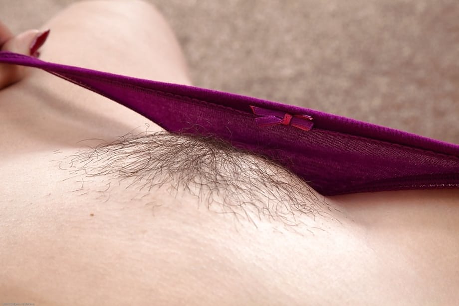 Older MILF shows off nice ass before spreading hairy cooter