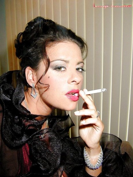 Busty stocking and lingerie clad MILF Linsey Dawn McKenzie having a smoke