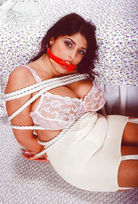 Busty balled gagged Euro pornstar Kerry Marie undergoing BDSM session