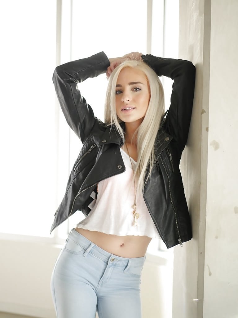 Blonde teen babe Naomi Woods pulling jeans down over ass and legs
