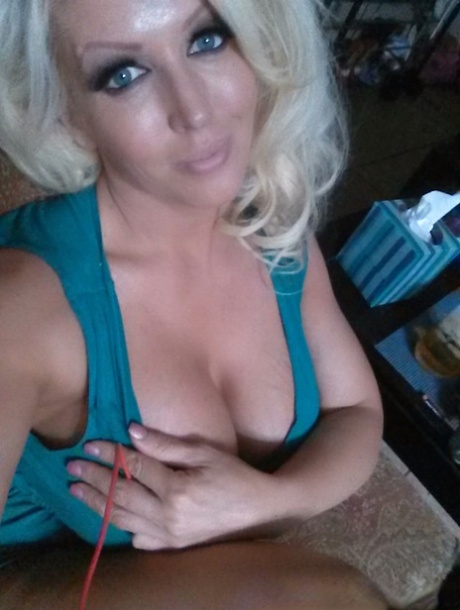 Platinum blonde bombshell Alura Jenson baring big tits for selfie
