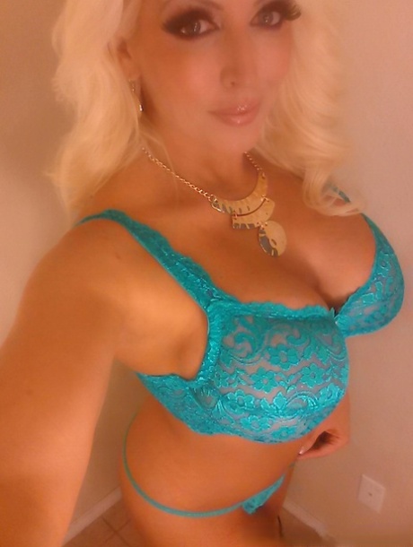 Platinum blonde bombshell Alura Jenson baring big tits for selfie