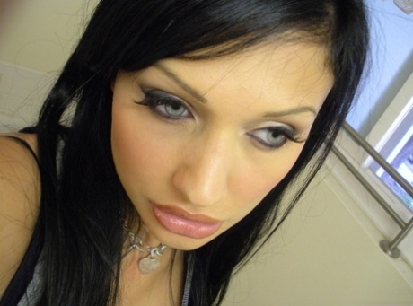 European chick Aletta Ocean takes topless selfies in mirror wearing a thong