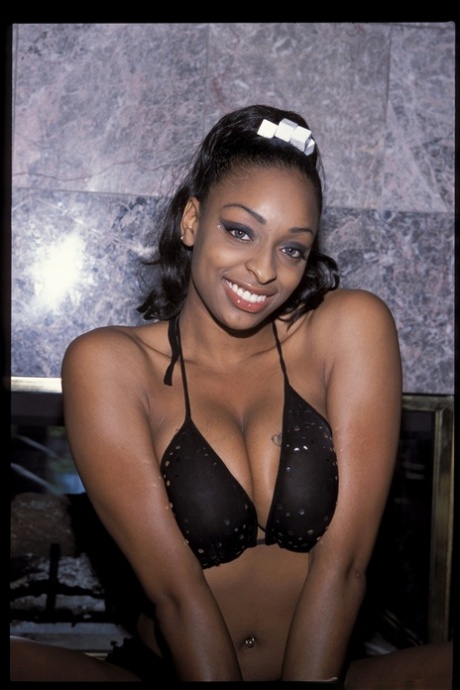 Black MILF Carmen Hayes pleases two cocks at the same time with oral sex