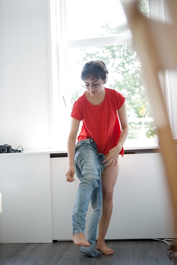 Skinny nerd Yasmeena pulling panties and jeans on while getting dressed