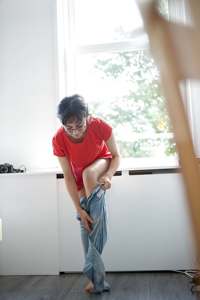 Skinny nerd Yasmeena pulling panties and jeans on while getting dressed