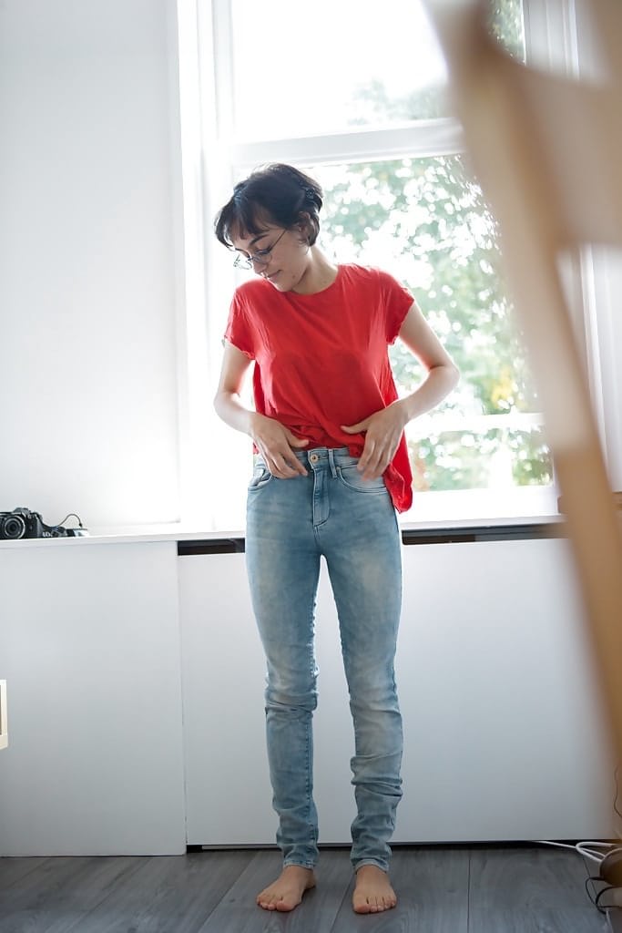 Skinny nerd Yasmeena pulling panties and jeans on while getting dressed