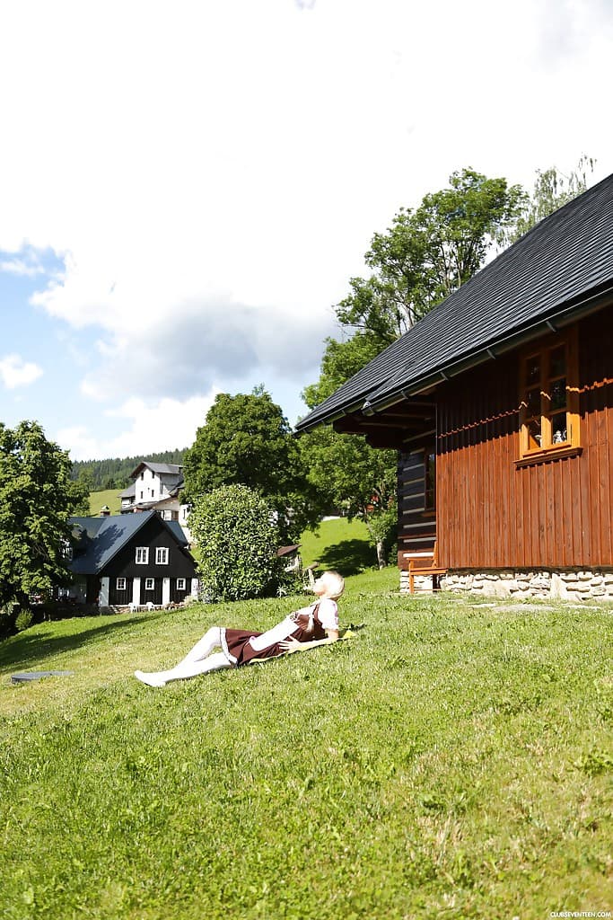 Swiss farm girl Karol Lilien toying pussy on lawn in pigtails