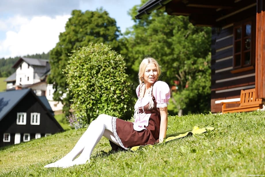 Swiss farm girl Karol Lilien toying pussy on lawn in pigtails