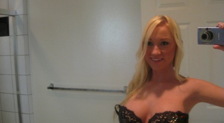 Blonde chick Madison Scott takes selfies as she undresses with a sex doll