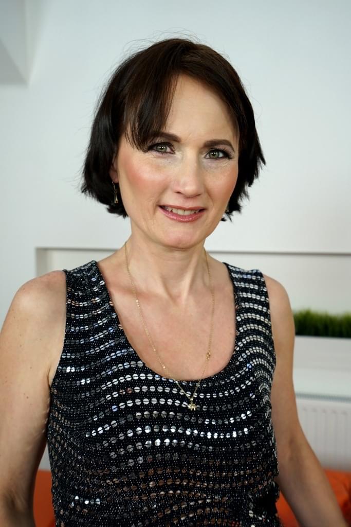 Short haired granny Alice Sharp bares her saggy tits as she strips naked