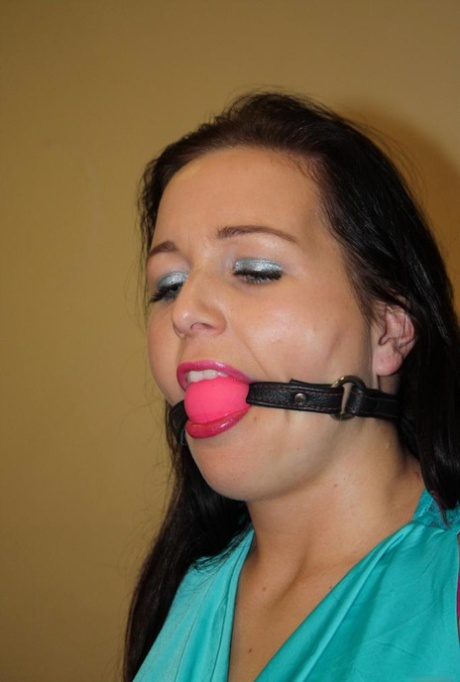 Ball gagged brunette is left all alone tied to a chair with ropes