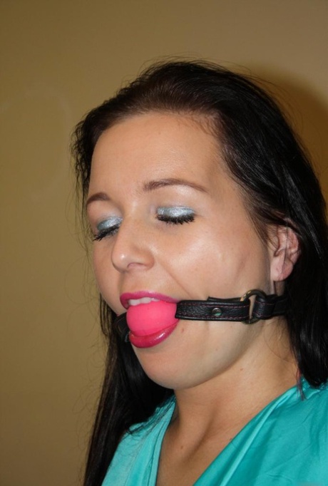 Ball gagged brunette is left all alone tied to a chair with ropes
