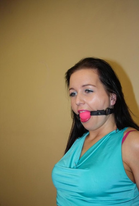 Ball gagged brunette is left all alone tied to a chair with ropes