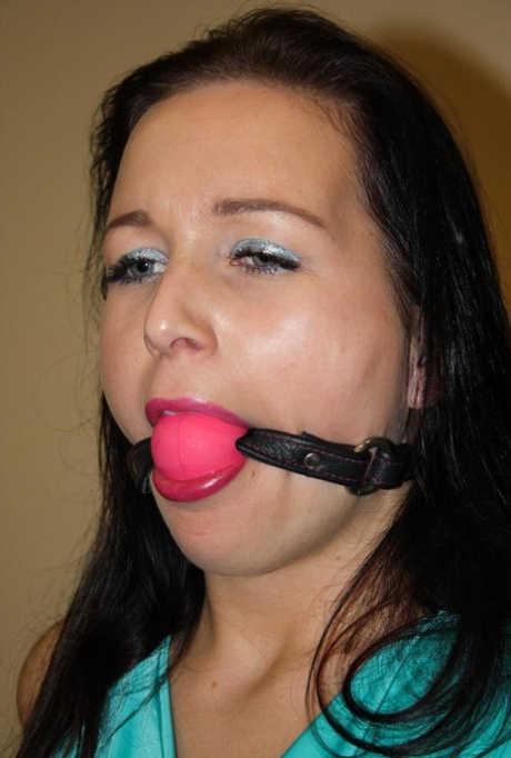 Ball gagged brunette is left all alone tied to a chair with ropes