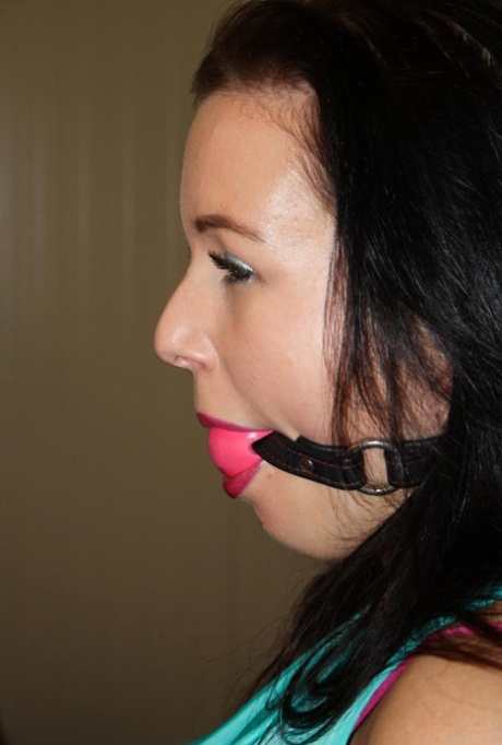 Ball gagged brunette is left all alone tied to a chair with ropes