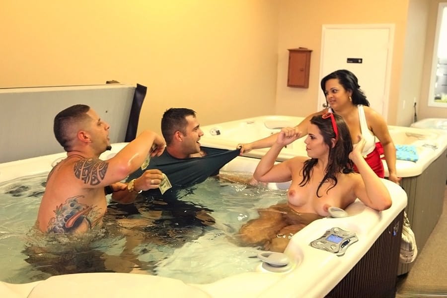 Amateur female is stripped naked for sex games in a hot tub