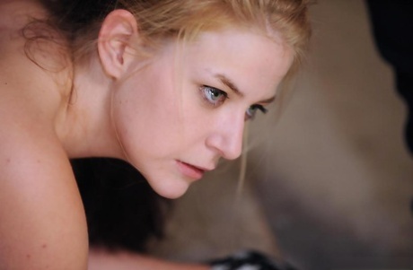 Blonde sex slave is used after being restrained to a pallet like a dog