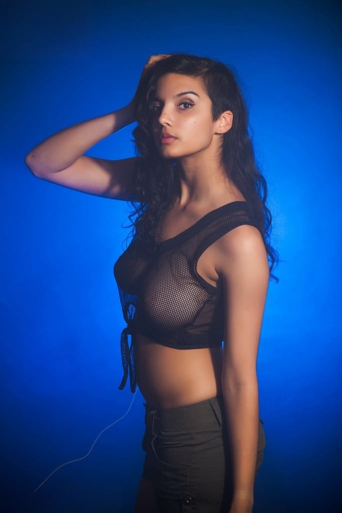 Indian female models non nude in a see thru top and shorts