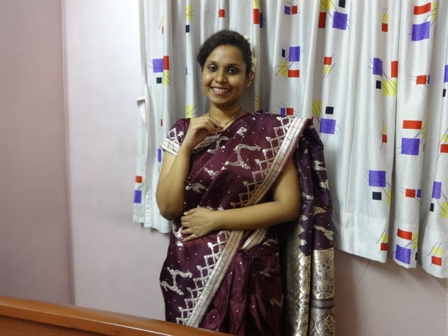 Clothed Indian woman strips to her black bra and underskirt