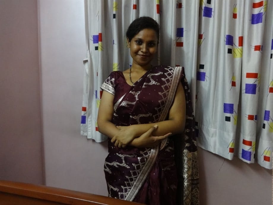 Clothed Indian woman strips to her black bra and underskirt