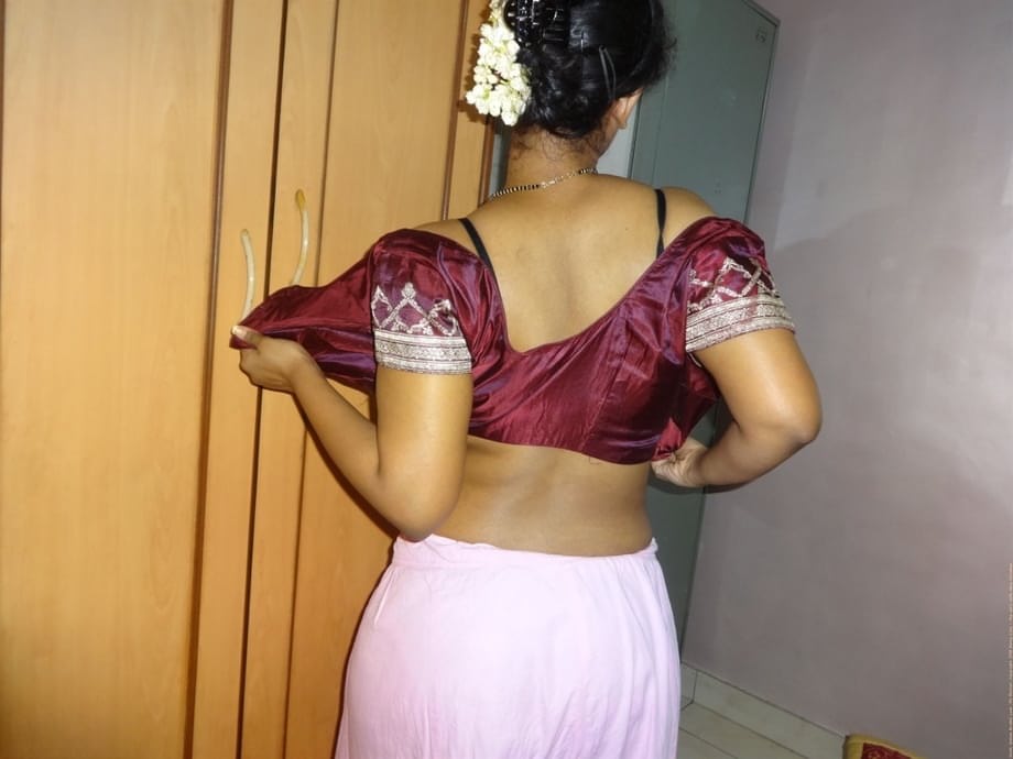 Clothed Indian woman strips to her black bra and underskirt