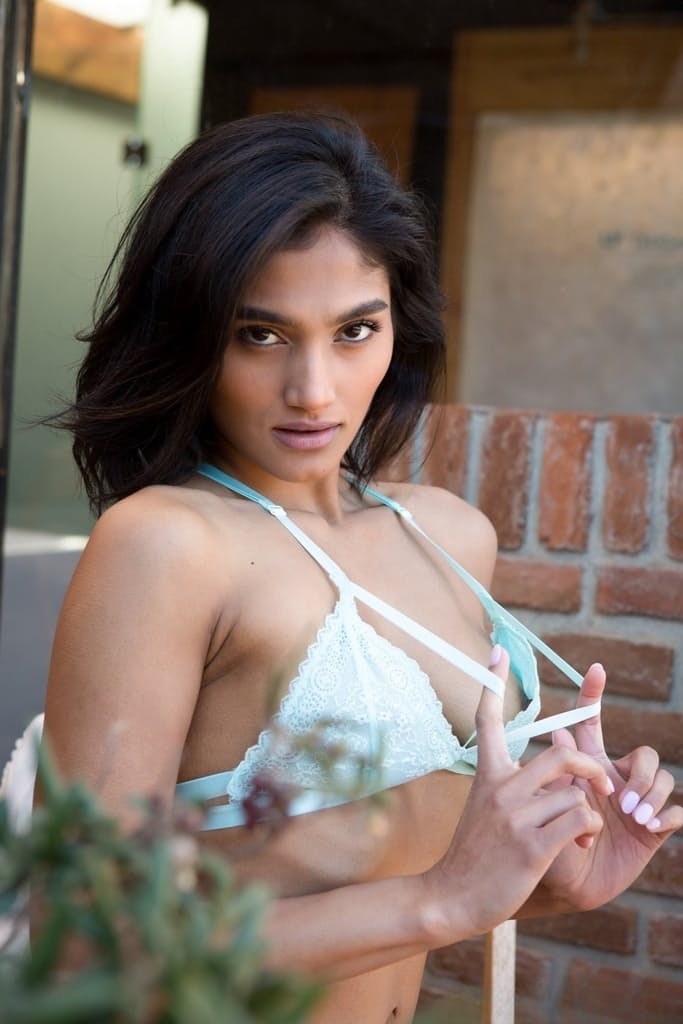 Centerfold model Angel Constance takes off her bra and panties on the deck
