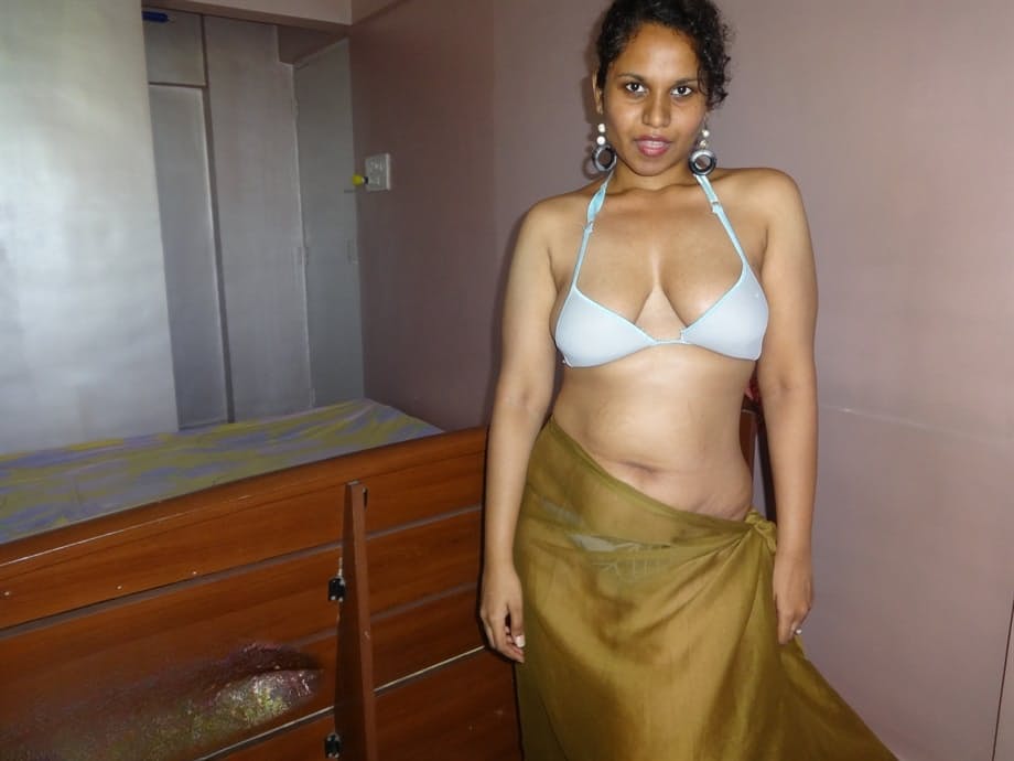 Indian woman lets a boob slip loose from her bra while being a tease