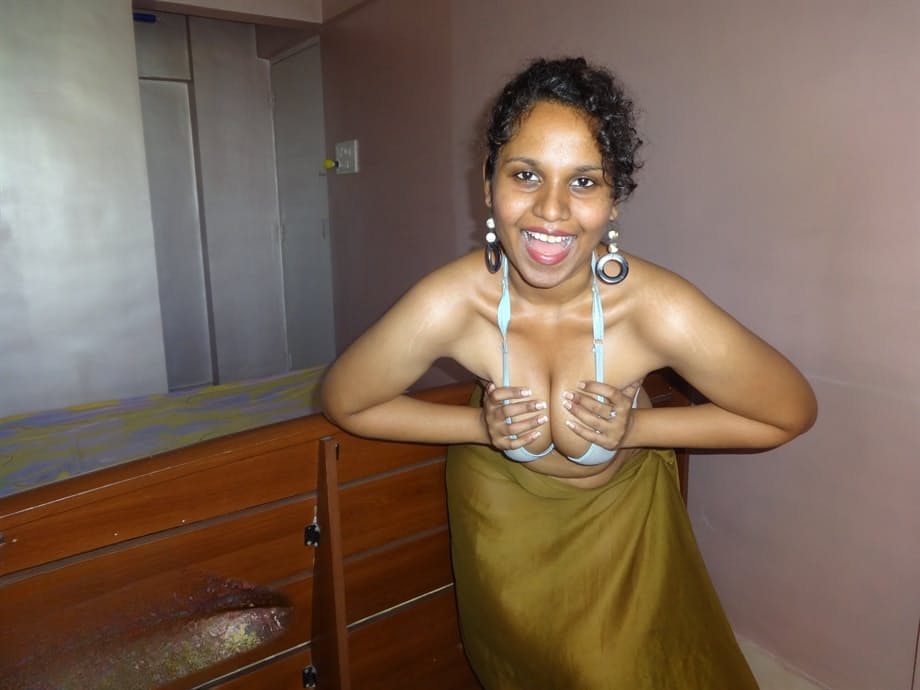 Indian woman lets a boob slip loose from her bra while being a tease
