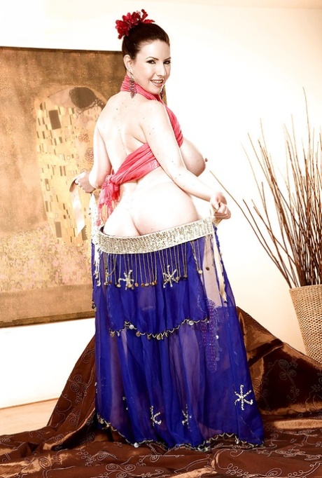 Busty belly dancer Karina Hart flashing fat boobs and slides dildo in her snatch