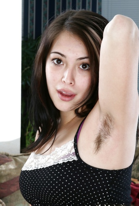 Lovely teen babe showing off her hairy armpits and stripping