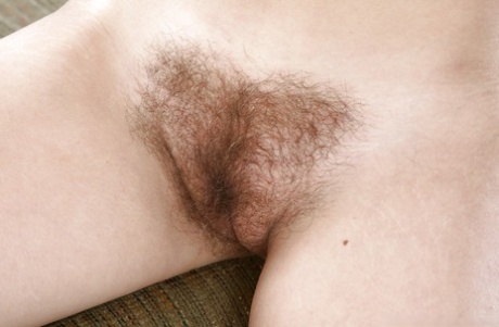 Lovely teen babe showing off her hairy armpits and stripping