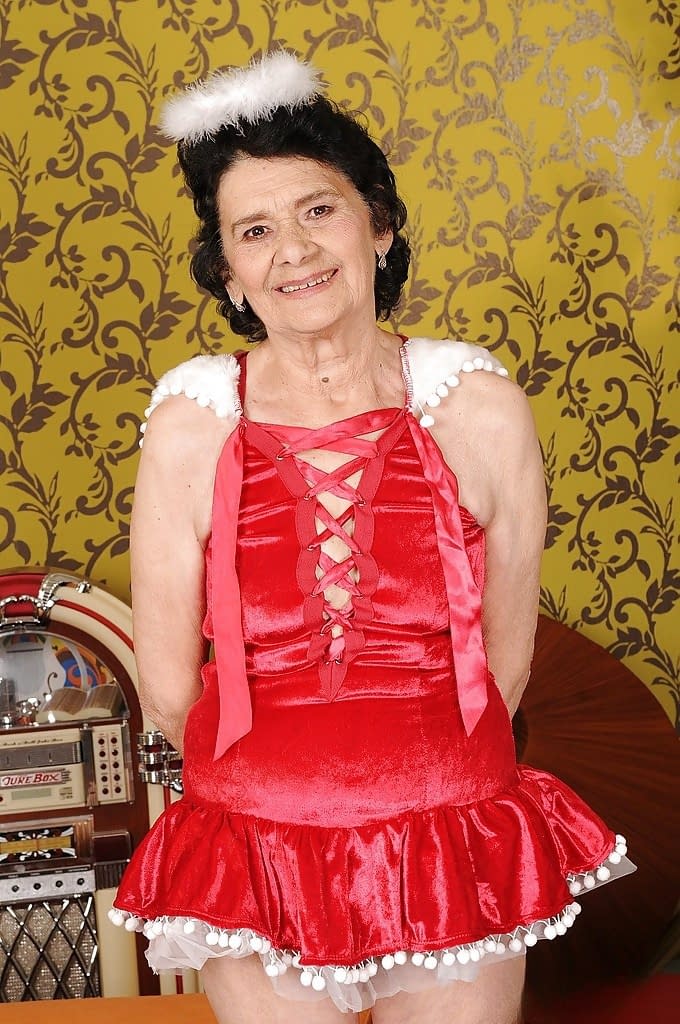 Lusty granny with no panties under her skirt showcasing her hairy cunt