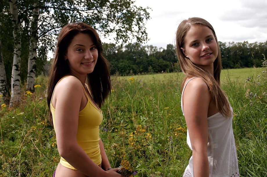 Seductive teen babes sshowcasing their petite curves for photos outdoor