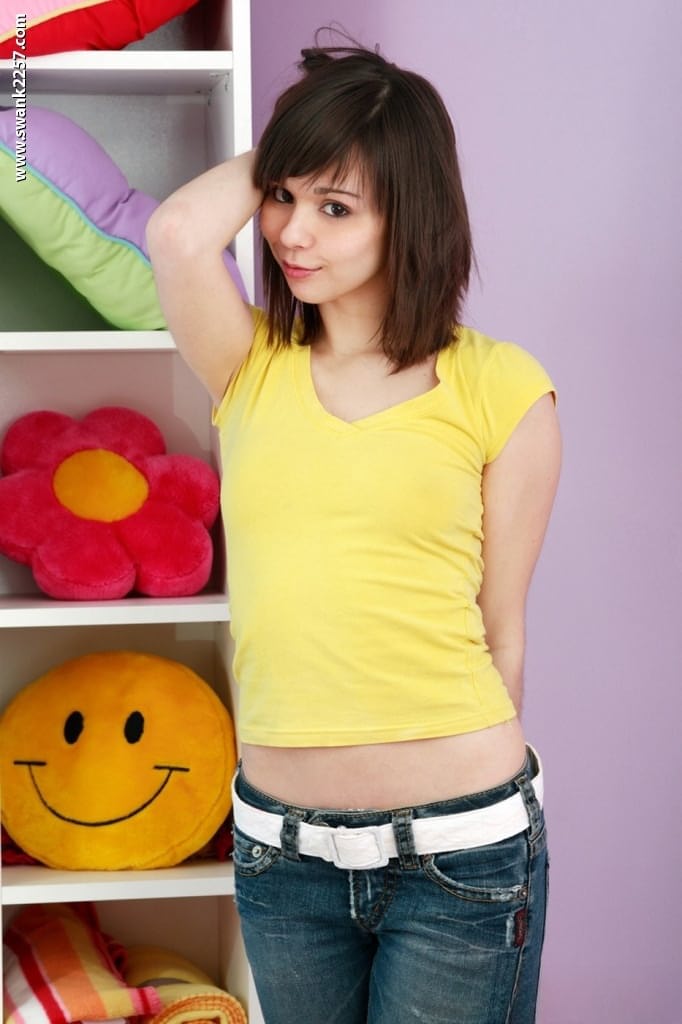 Svelte teen brunette Ariel Rebel stripping and exposing her petite body