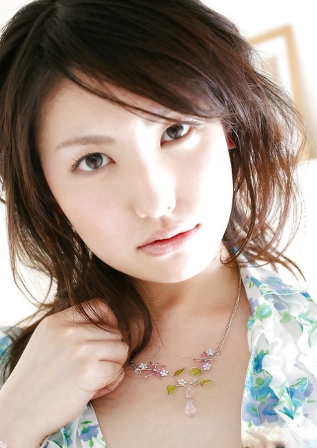 Sweet asian babe Takako Kitahara stripping and posing on the bed