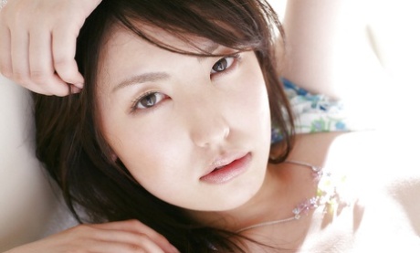 Sweet asian babe Takako Kitahara stripping and posing on the bed