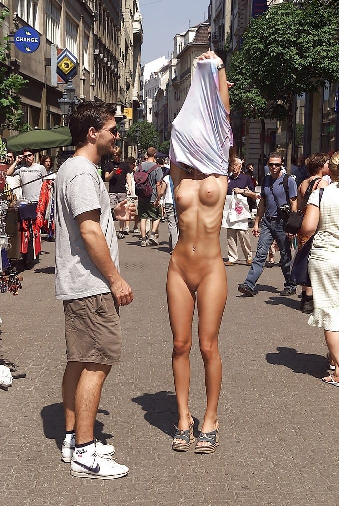 Graceful amateur babe with amazing tits posing naked in public place