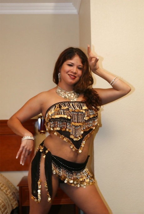 Chubby indian lady with ample ass stripping and spreading her legs