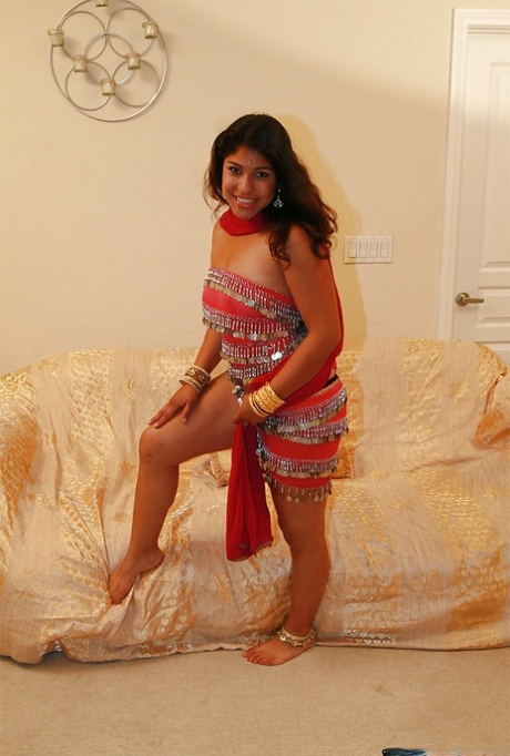 Chubby indian chick uncovering her nice jugs and shaggy pussy