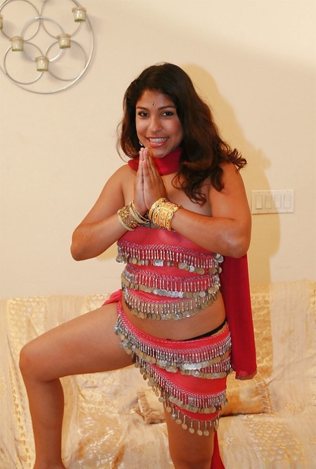 Chubby indian chick uncovering her nice jugs and shaggy pussy