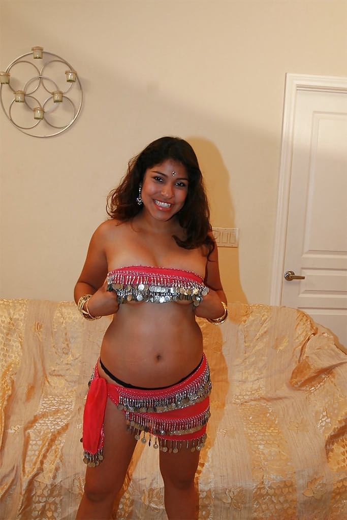 Chubby indian chick uncovering her nice jugs and shaggy pussy