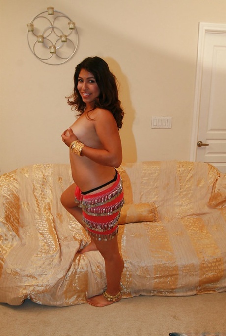 Chubby indian chick uncovering her nice jugs and shaggy pussy